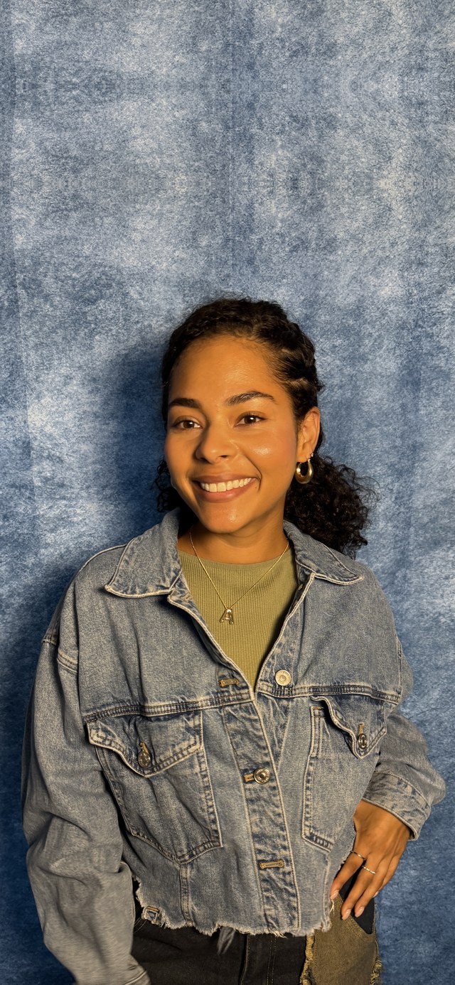 An actor smiling mid-take, framed for a self-tape